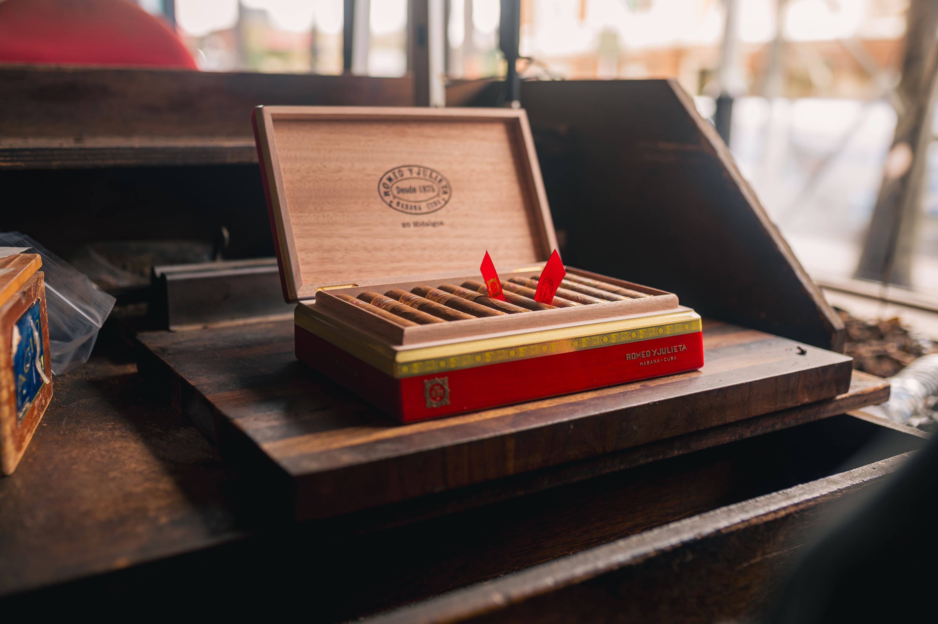 A cigar collector with a humidor at sunset